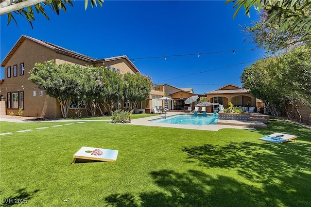 outdoor pool with a yard, a patio, an outdoor structure, and fence