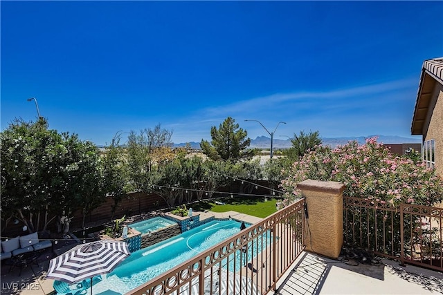 balcony with a pool with connected hot tub