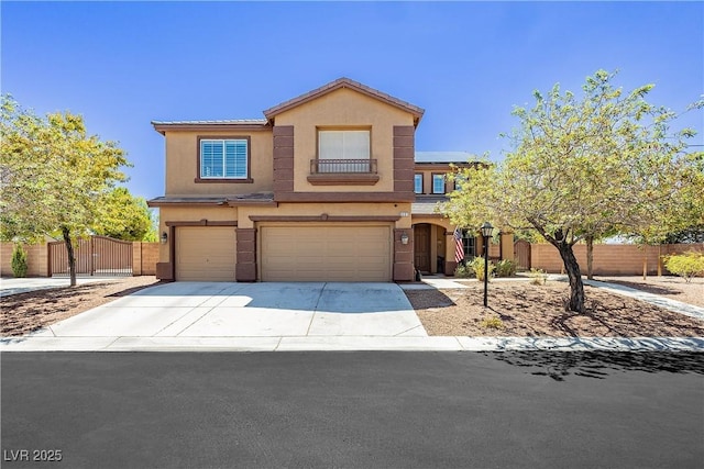 view of front facade with fence, stucco siding, a garage, driveway, and a gate