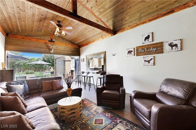 living area featuring wood ceiling, lofted ceiling with beams, and a ceiling fan