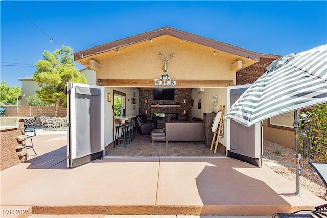 view of patio / terrace featuring fence