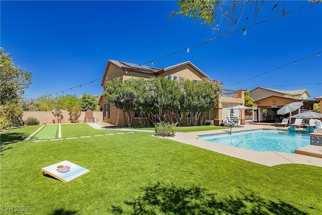 view of pool with a patio, a fenced in pool, a yard, a fenced backyard, and a gazebo