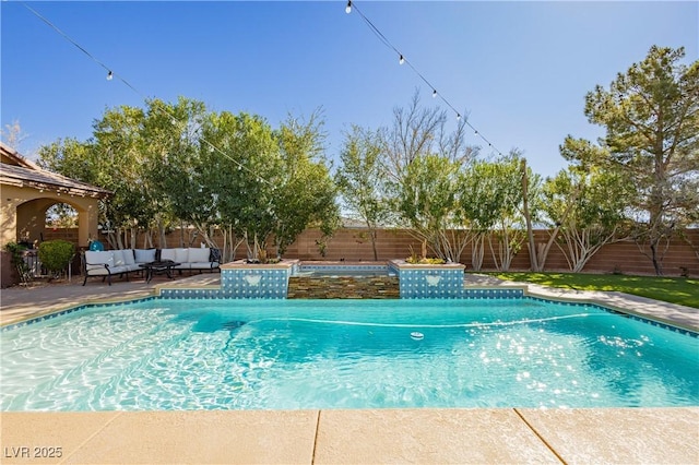 view of pool with a fenced in pool, a fenced backyard, outdoor lounge area, and a patio area