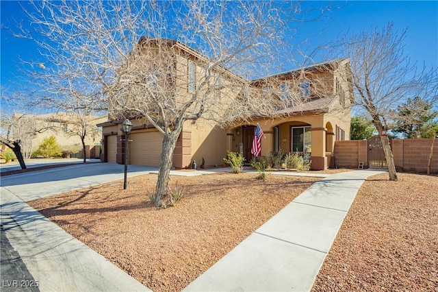 view of front of home with a gate, fence, driveway, stucco siding, and a garage