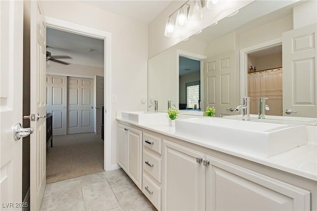 6391 Tempting Choice Ave, Las Vegas, NV 89131 - full bath featuring double vanity, ceiling fan, and tile patterned floors