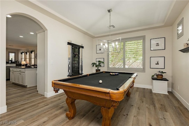 playroom with arched walkways, wood finished floors, billiards table, baseboards, and recessed lighting
