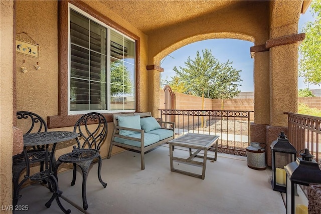 view of patio / terrace featuring fence