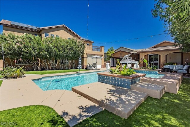 swimming pool featuring outdoor lounge area and a patio area