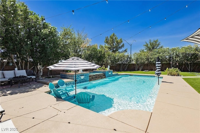 view of pool featuring a fenced backyard, a fenced in pool, a fire pit, and a patio