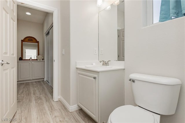 6391 Tempting Choice Ave, Las Vegas, NV 89131 - bathroom featuring vanity, toilet, and wood finished floors