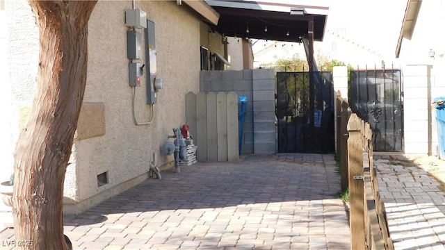 view of gate with fence