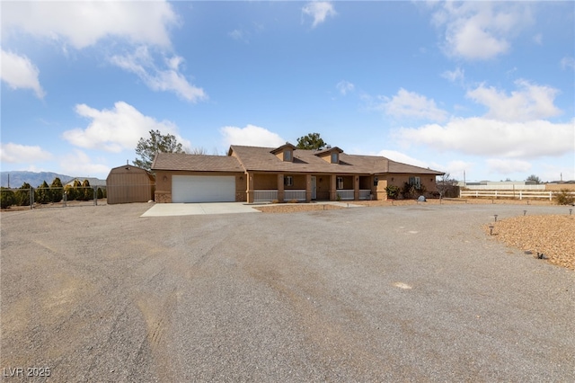 single story home with fence, a garage, and driveway