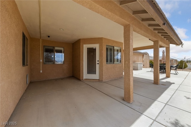 view of patio featuring outdoor dining area