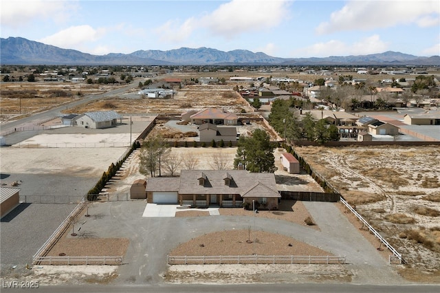 birds eye view of property with a mountain view and a residential view