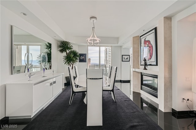 dining space featuring plenty of natural light and baseboards