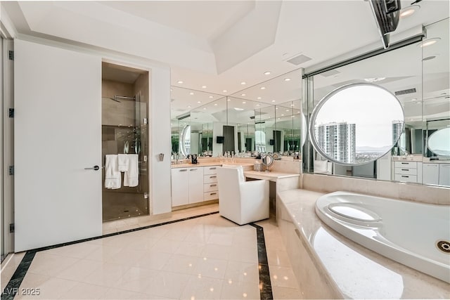 full bath with visible vents, vanity, a bath, and a shower stall