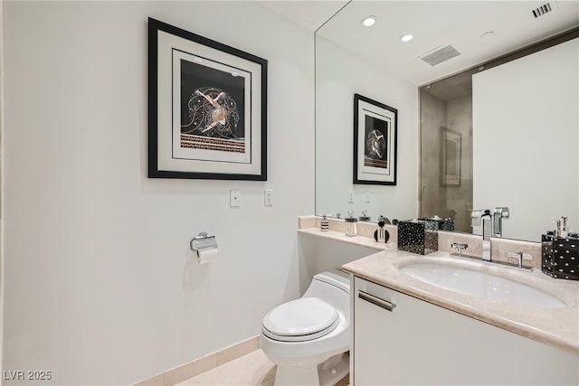 bathroom with vanity, toilet, a shower, and visible vents