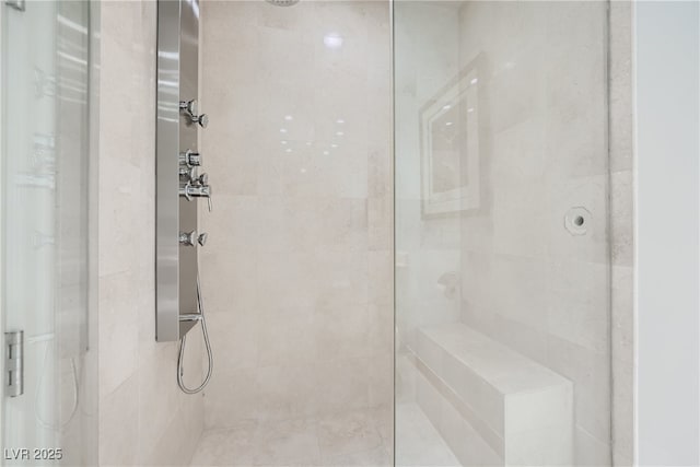 full bath with tiled shower