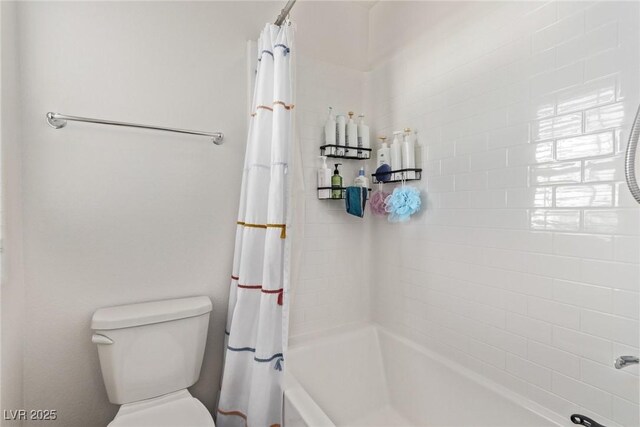 full bath featuring shower / bath combination with curtain and toilet