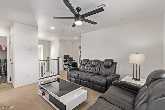 living room featuring visible vents, a ceiling fan, recessed lighting, baseboards, and light colored carpet