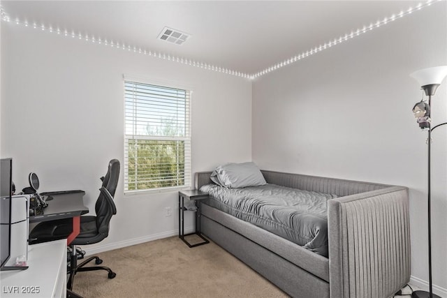 bedroom featuring visible vents, carpet floors, and baseboards