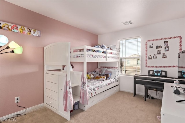 bedroom featuring visible vents, baseboards, and carpet