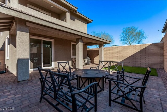 view of patio / terrace featuring fence