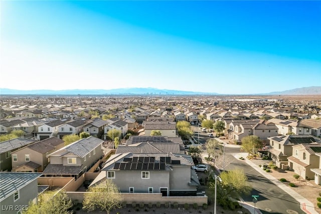 birds eye view of property with a mountain view and a residential view