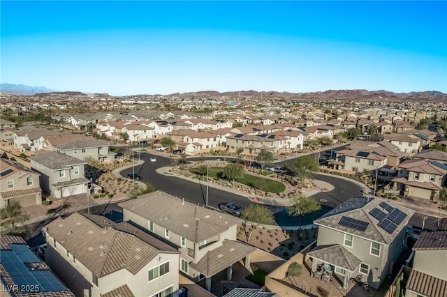 birds eye view of property with a mountain view and a residential view