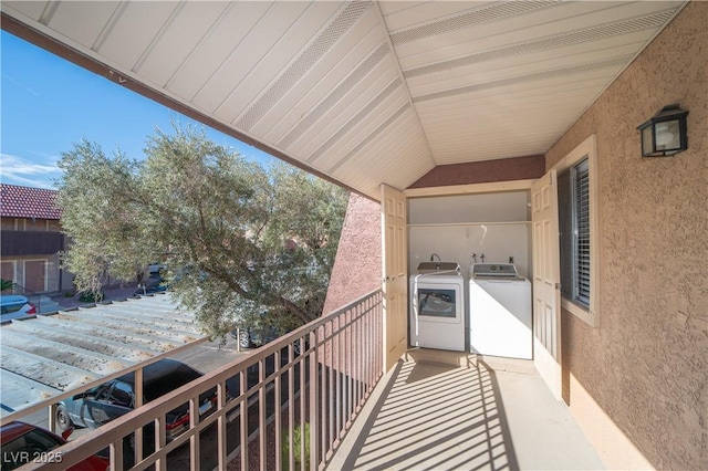 balcony featuring washer and clothes dryer