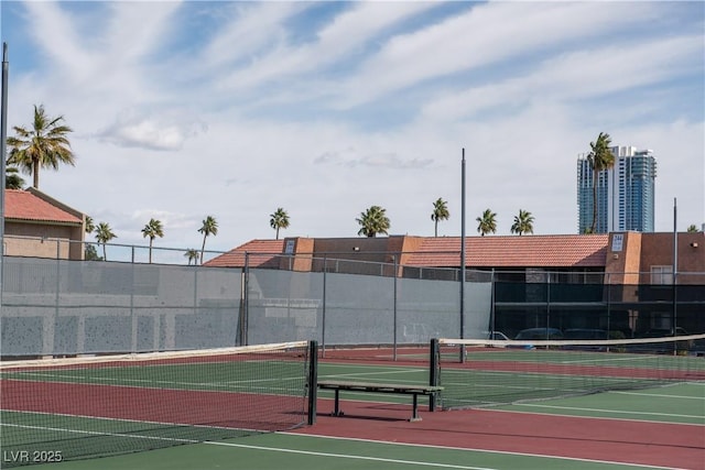 view of sport court featuring fence