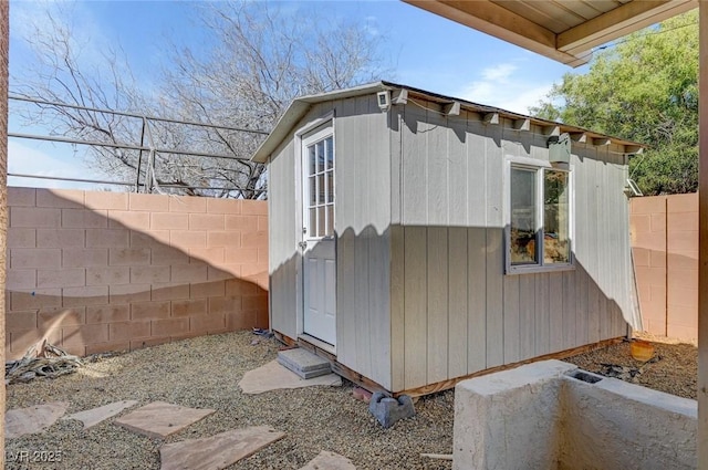 view of shed featuring a fenced backyard