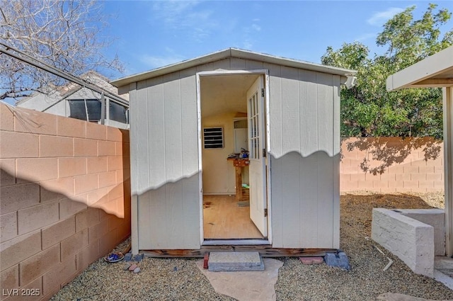 view of shed with a fenced backyard