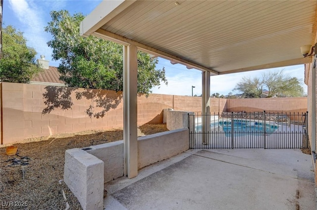 view of patio / terrace with a fenced backyard and a fenced in pool