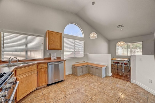 kitchen featuring a wealth of natural light, visible vents, appliances with stainless steel finishes, and a sink