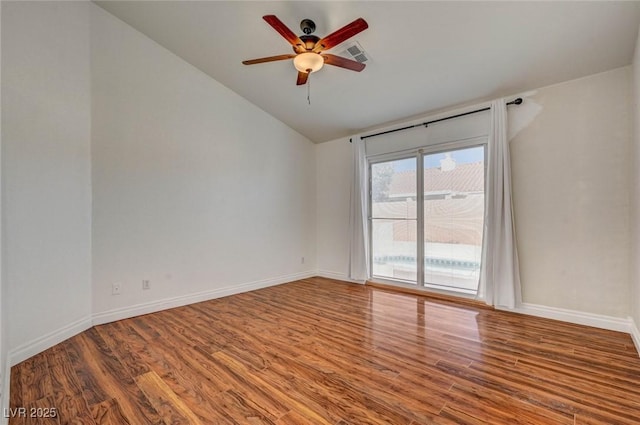 empty room with a ceiling fan, wood finished floors, and baseboards