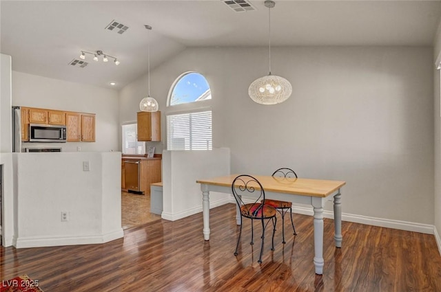 kitchen with dark wood finished floors, visible vents, and appliances with stainless steel finishes