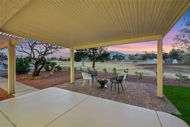 view of patio / terrace with an outdoor fire pit