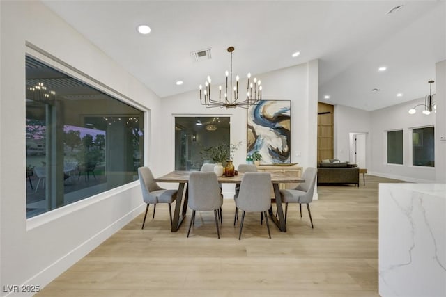 dining area featuring visible vents, lofted ceiling, recessed lighting, light wood-style floors, and a chandelier