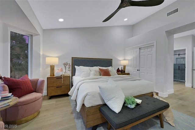 bedroom featuring recessed lighting, light wood-style floors, visible vents, and a closet