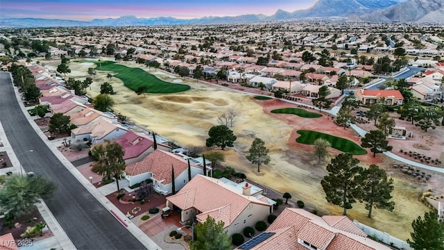 bird's eye view with a residential view, a mountain view, and view of golf course