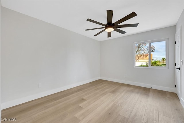 empty room with baseboards, ceiling fan, and light wood finished floors