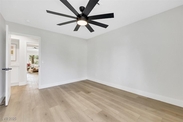 unfurnished room featuring light wood-style floors, baseboards, and ceiling fan