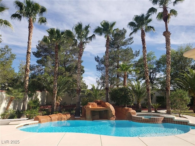 view of swimming pool with a pool with connected hot tub