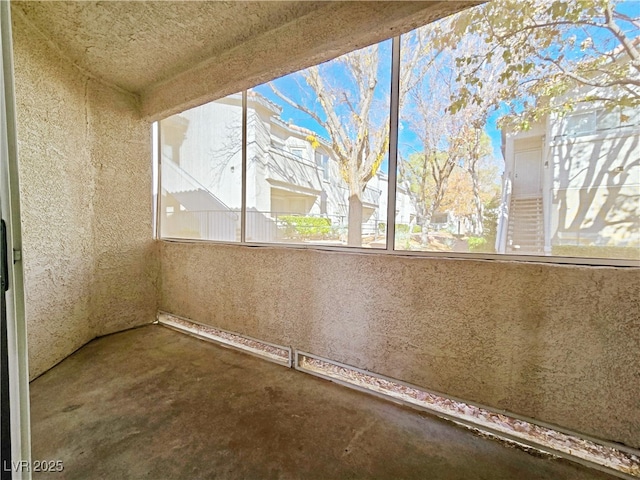 unfurnished sunroom with plenty of natural light