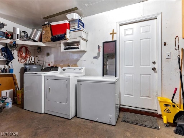 washroom featuring laundry area and washer and clothes dryer