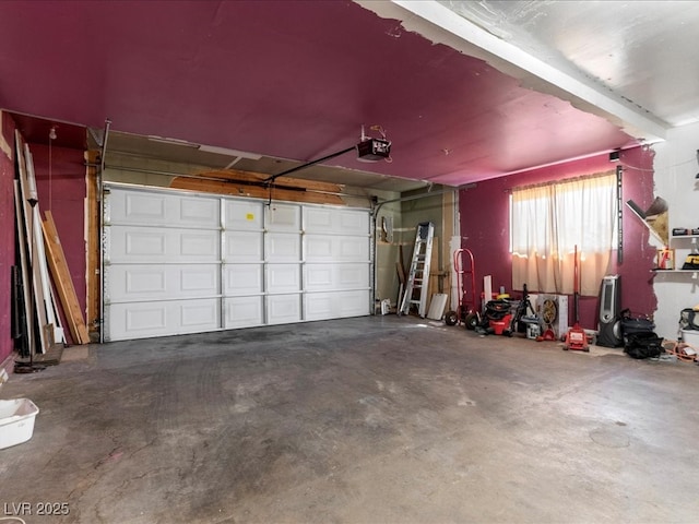 garage featuring a garage door opener