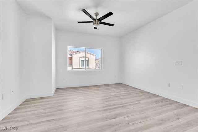 empty room with baseboards, light wood-type flooring, and ceiling fan