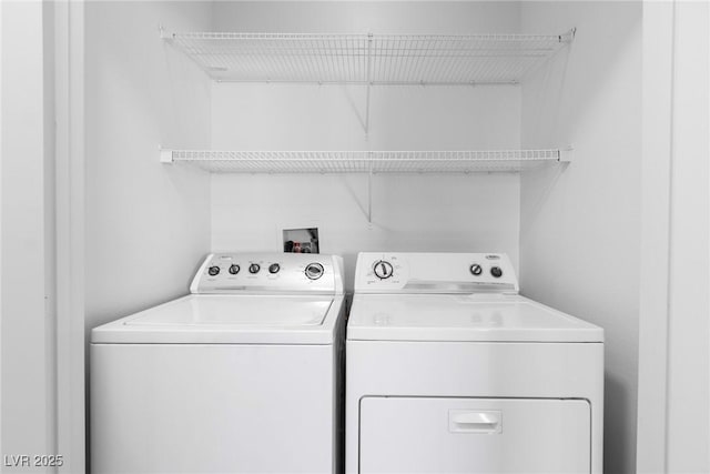 clothes washing area with laundry area and separate washer and dryer