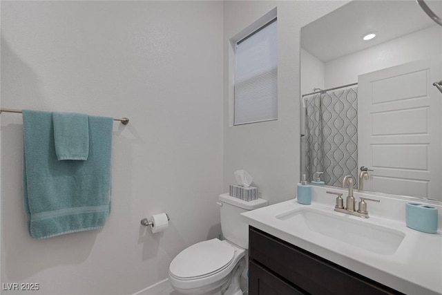 bathroom featuring a shower with shower curtain, baseboards, toilet, and vanity